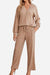 Woman wearing Desert Bloom Ribbed Comfort Set in beige ribbed fabric with a V-neck top and wide-leg pants
